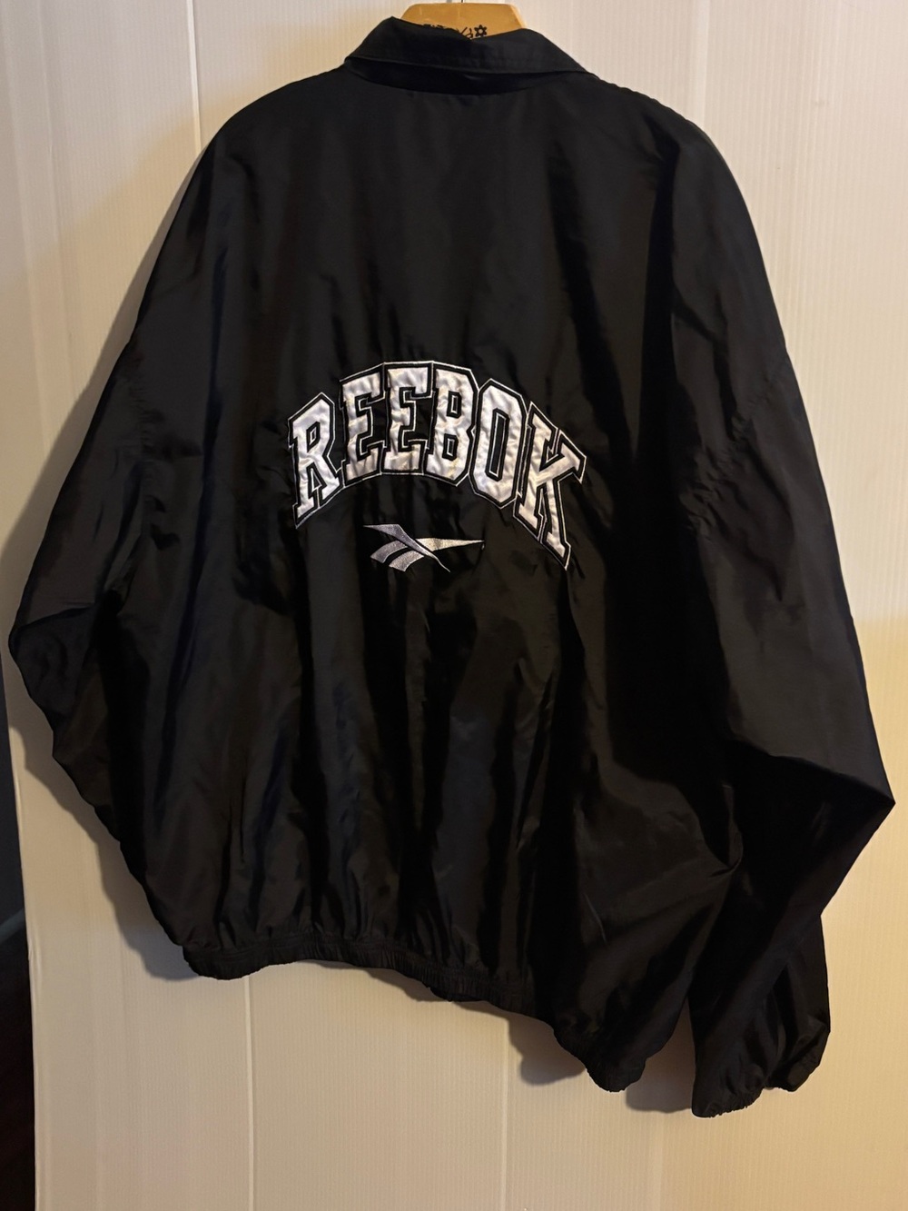 vintage 1990s Reebok spell-out nylon windbreaker jacket